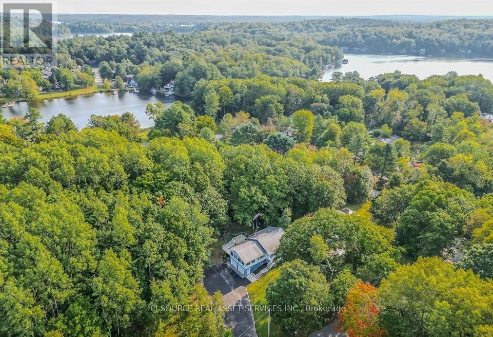 Aerial view of property and lake